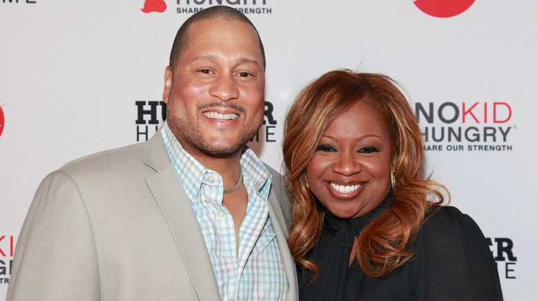 Pat and Gina Neely smiling at a Food Network event
