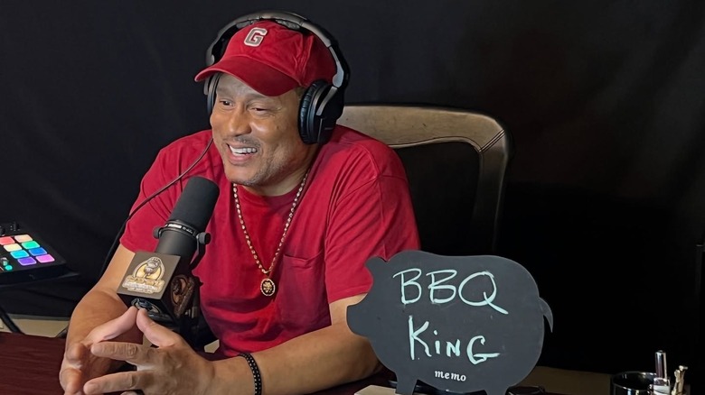 Pat Neely wearing red while talking into a mic