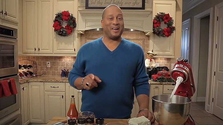 Pat Neely cooking in his Christmas-decorated home