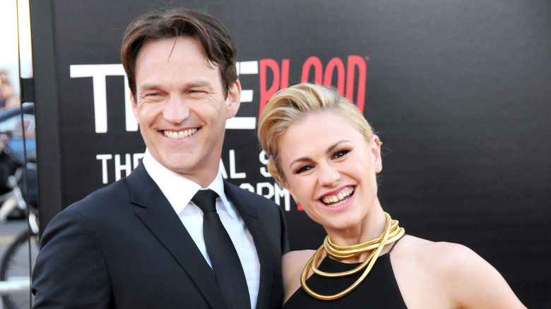 Stephen Moyer and Anna Paquin smiling at the 2014 premiere of the final season of "True Blood"