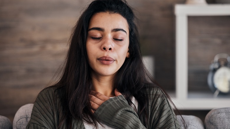 Woman doing breathing exercises