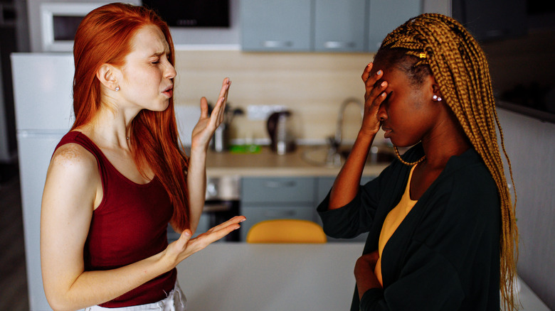 Couple arguing in kitchen
