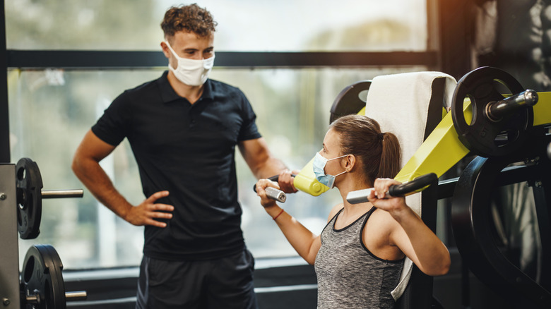 Gym members wear masks