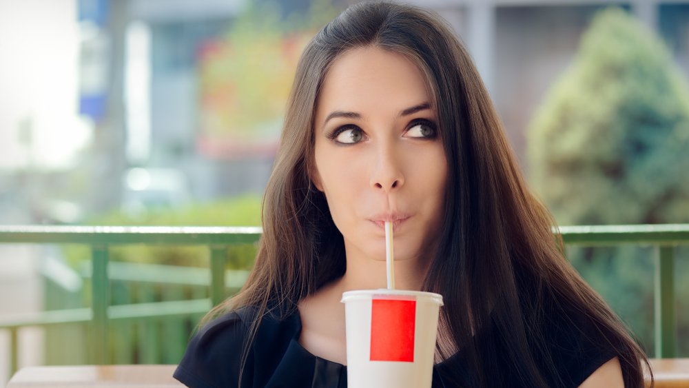 Woman drinking Diet Coke