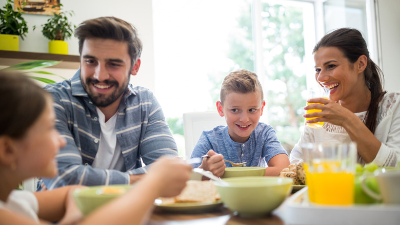 a family enjoying breakfast and orange juice