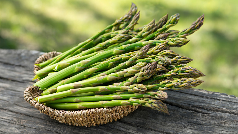 Asparagus stalks in woven basket