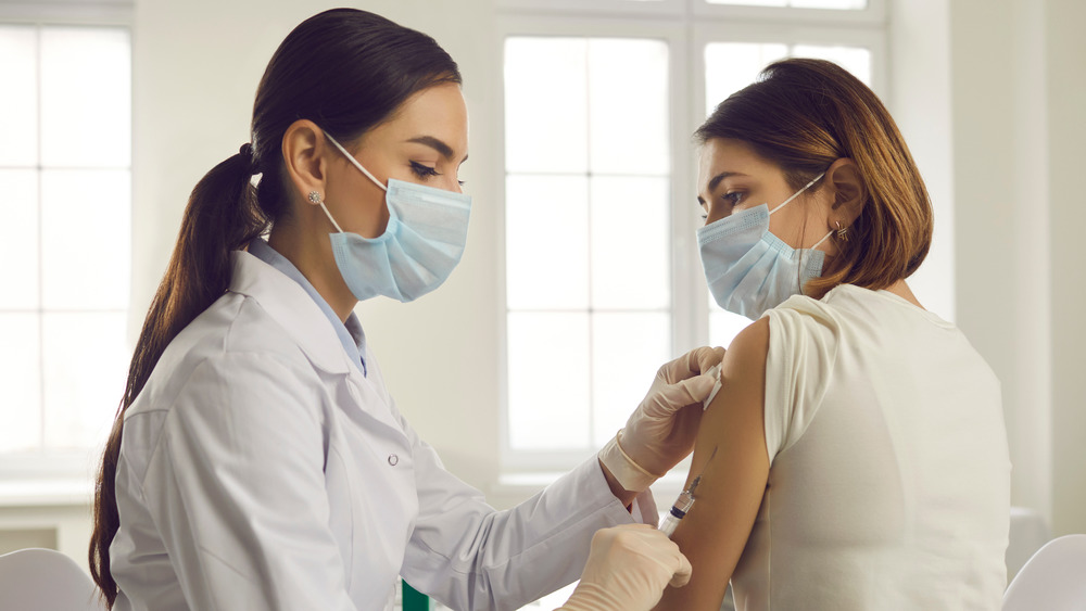 doctor vaccinating patient