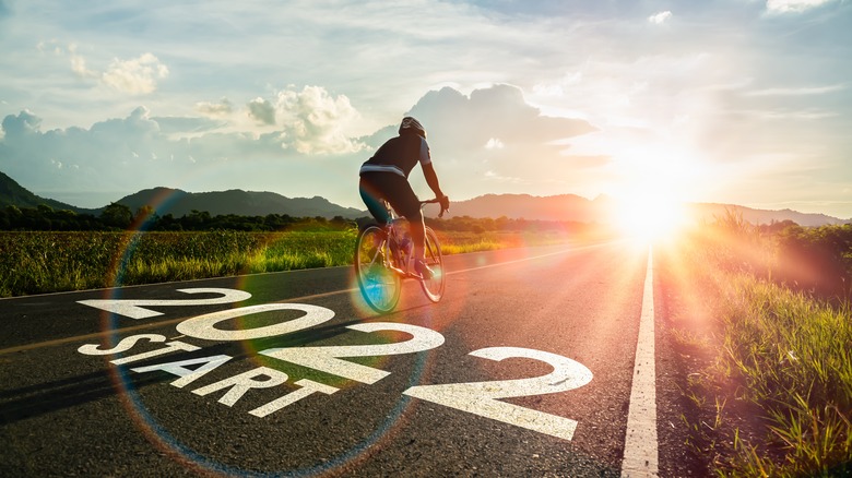 person cycling on a road