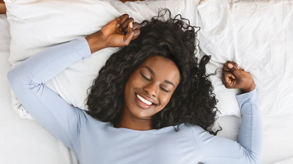 A woman in bed napping