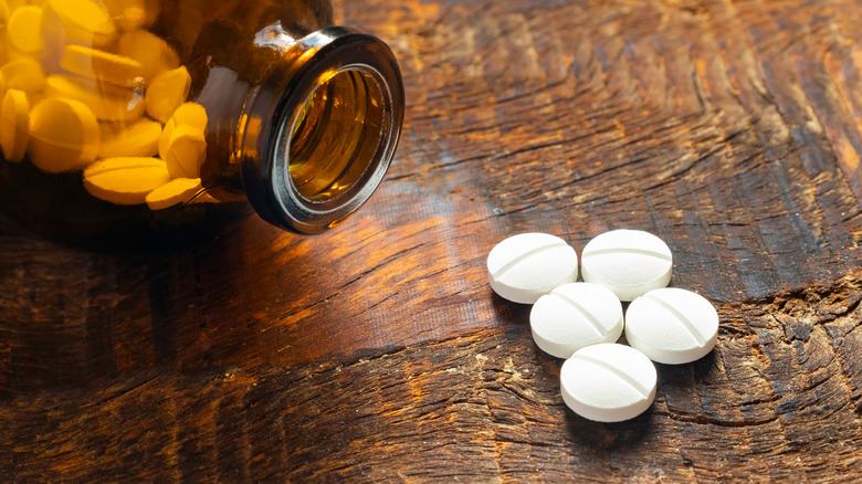 aspirin pills lying on table 