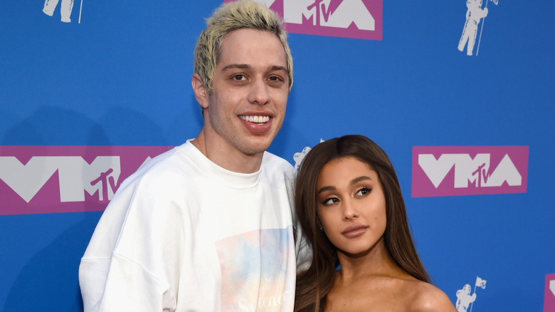 Ariana Grande and Pete Davidson posing at an awards show