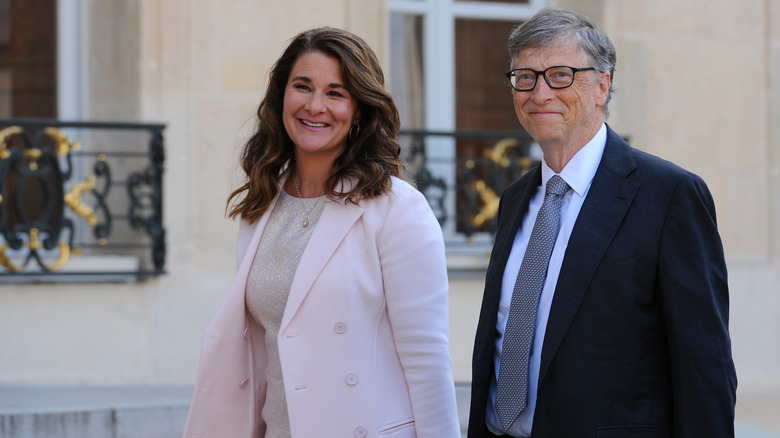 Bill Gates and Melinda Gates smiling while walking together