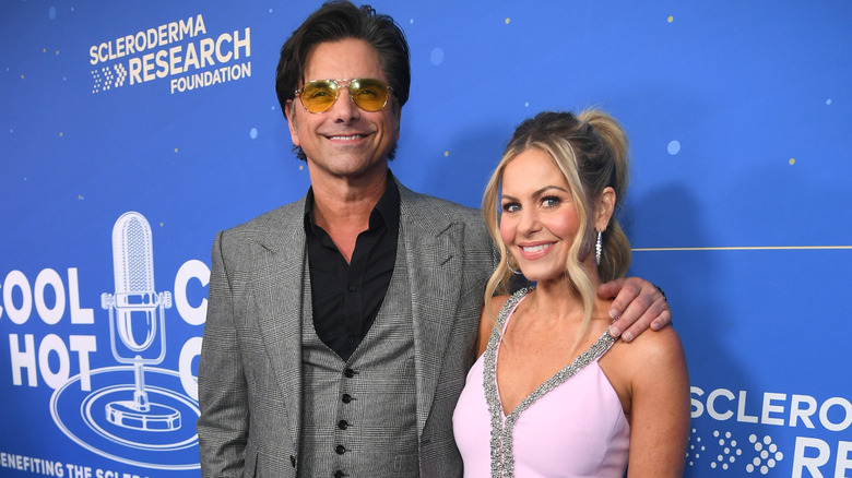 John Stamos arm around Candace Cameron Bure