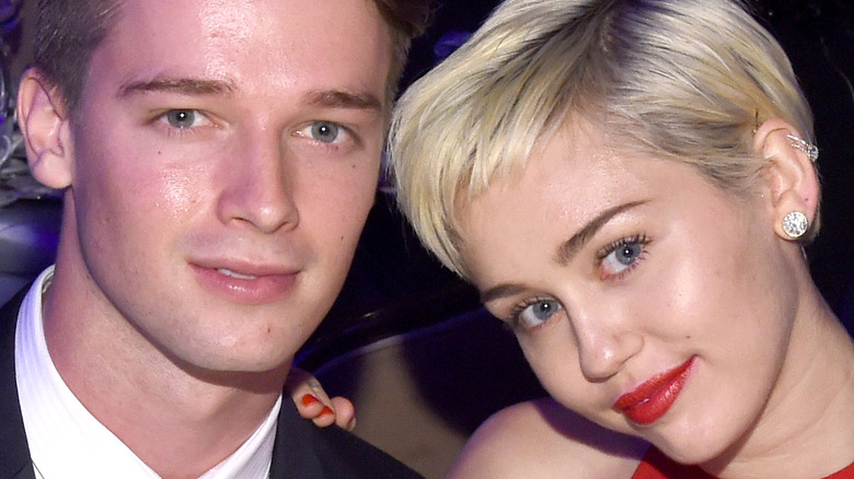 Miley Cyrus and Patrick Schwarzenegger smile for the camera