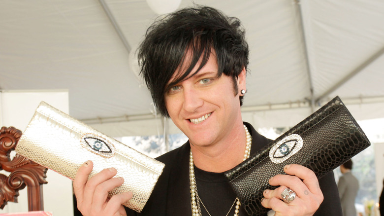 Seth Aaron Henderson posing with bags at a party in 2011.