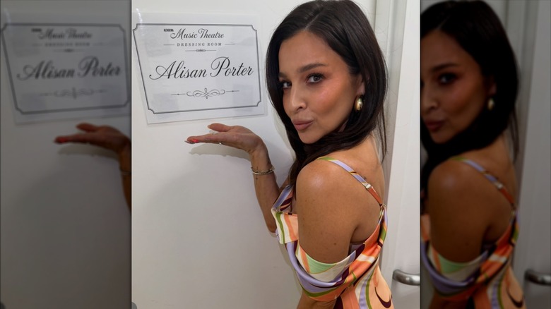 Alisan Porter posing outside of her dressing room in a 2026 photo.