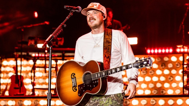 Morgan Wallen performing onstage at a concert in 2024.