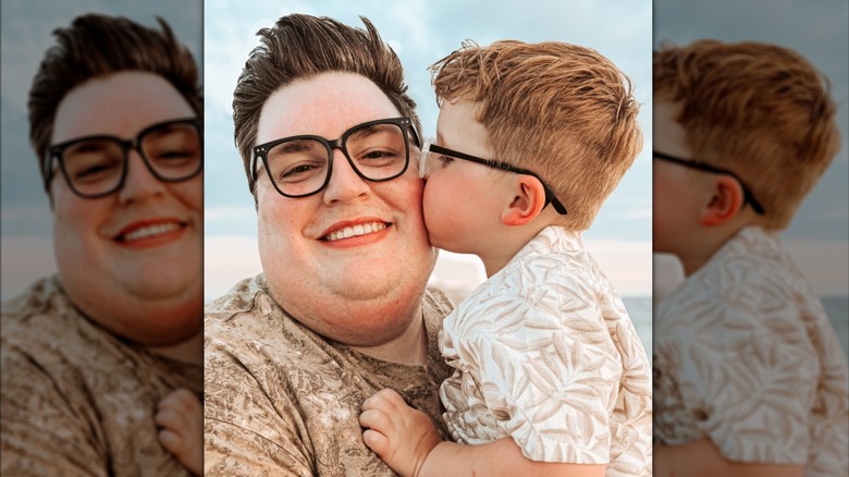 Jordan Smith's son giving him a kiss on the cheek.