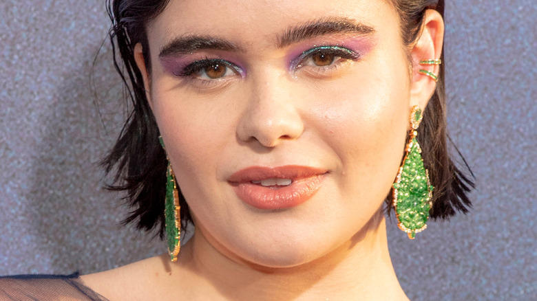 Barbie Ferreira with green earrings