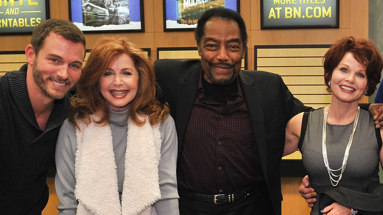 Days of Our Lives cast members pose for a photo.