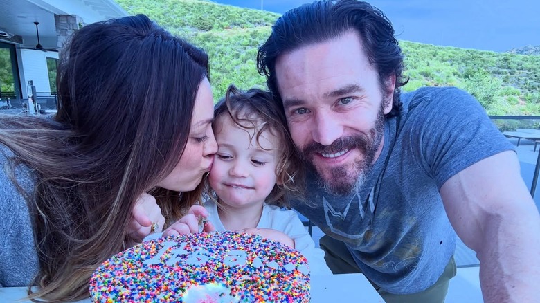Kaley Cuoco kissing her daughter