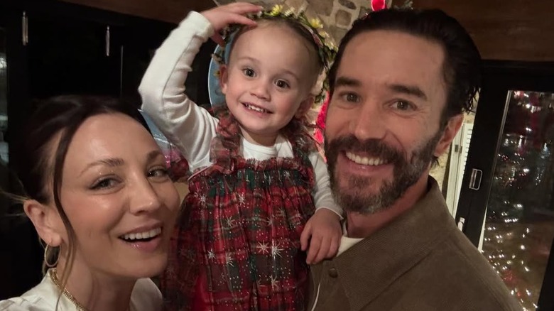 Kaley Cuoco, Tom Pelphrey, and their daughter Matilda posing for a photo