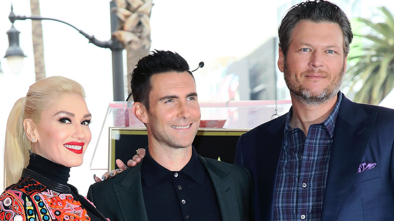 Gwen Stefani, Adam Levine, and Blake Shelton smiling