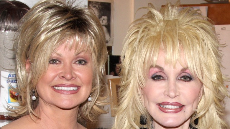Rachel Parton and Dolly Parton smiling to the camera.