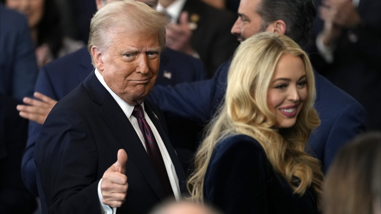 Donald and Tiffany Trump walking thumbs up