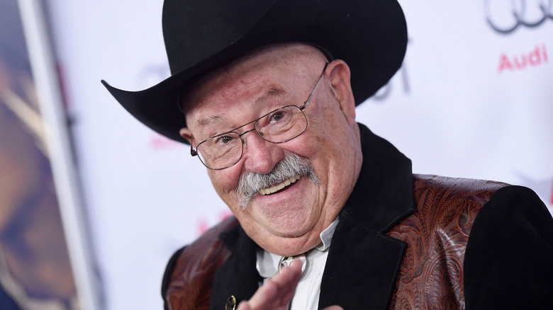 Barry Corbin grinning at the camera