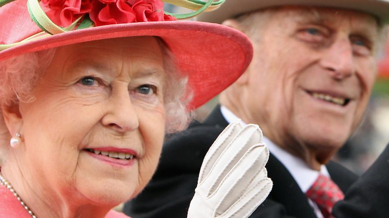 Queen Elizabeth II and Prince Philip waving