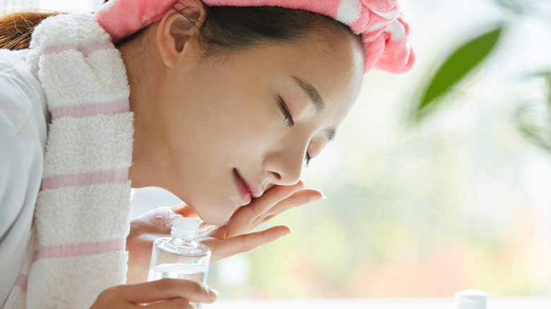 woman applying toner