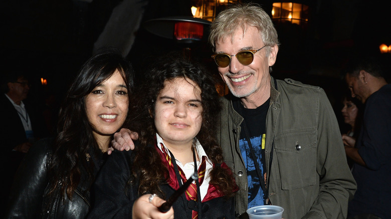 Billy Bob Thornton posing with his wife and daughter