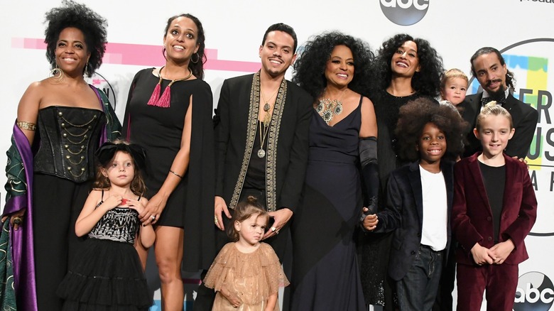 Diana Ross on the red carpet of the American Music Awards surrounded by her children and grandchildren