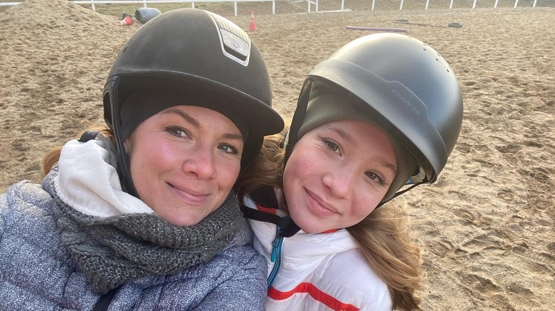 Sophie Gregoire smiles with her only daughter, Ella-Grace Trudeau, in a selfie wearing riding helmets