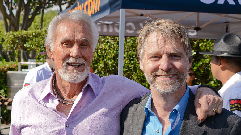 Kenny Rogers and Kenny Rogers Jr. posing together in 2013