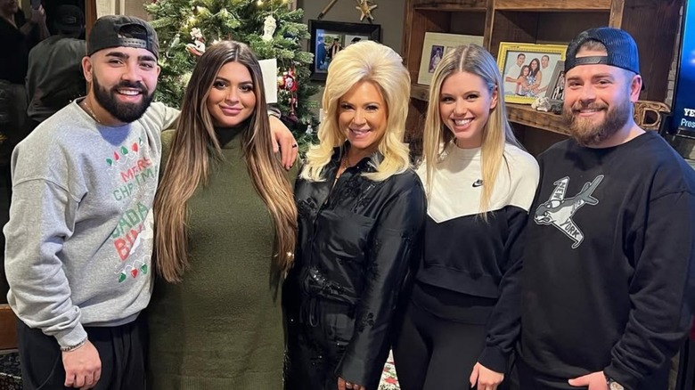 Michael Mastrandrea, Victoria Caputo, Theresa Caputo, Leah Munch, and Larry Caputo Jr. smiling