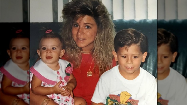 Larry Jr. Caputo, Victoria Caputo, and Theresa Caputo smiling