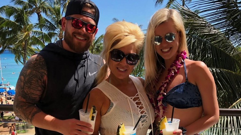 Larry Caputo Jr., Theresa Caputo, and Leah Munch smiling