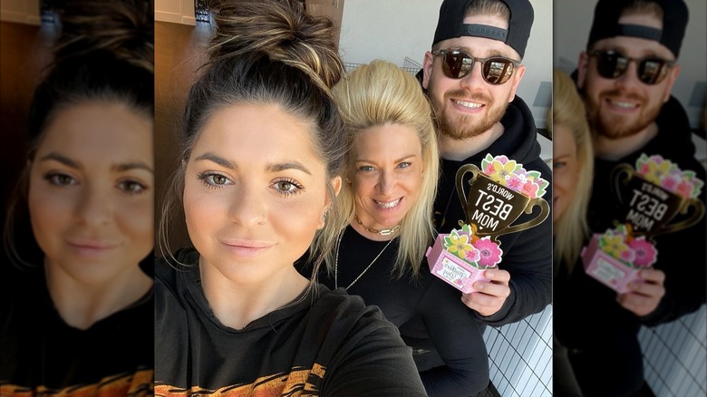 Victoria, Larry, and Theresa Caputo smiling