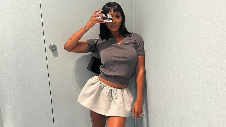 Elisa takes a selfie inside her room.