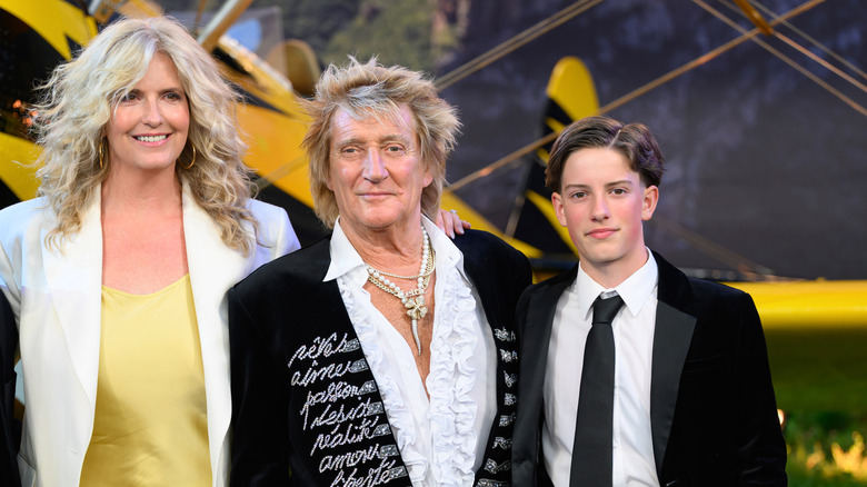 Rod Stewart with his wife Penny and youngest son, Aiden, all dressed up at a movie premiere