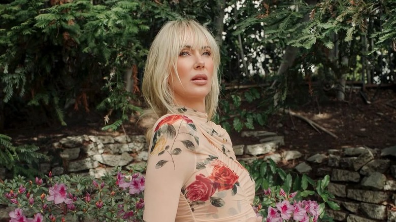 Kimberly Stewart posing in a flower dress