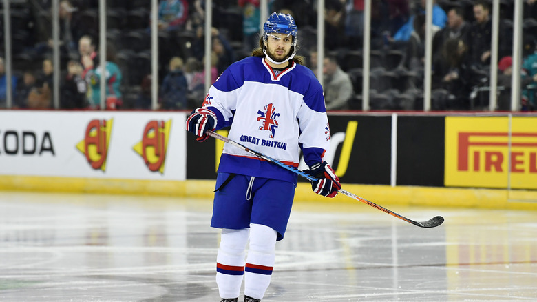 Liam Stewart playing hockey in his team uniform