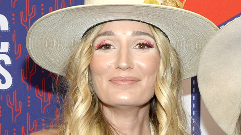 Close-up of Ruby Stewart wearing a beige hat