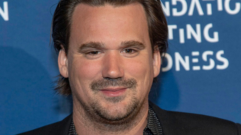 Sean Stewart smiling at an event