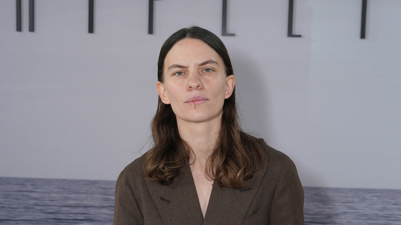 Eliot Sumner posing at an event for Netflix's Ripley