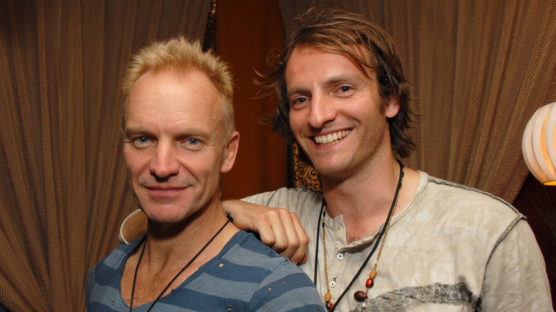 Sting and Joe Sumner smiling for a picture