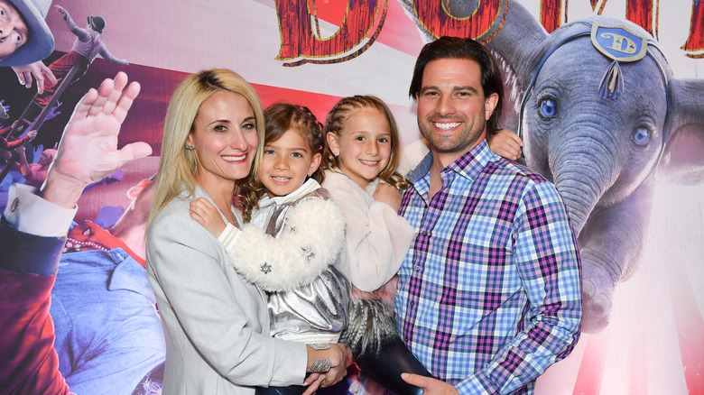 Scott McGillivray posing with wife and two daughters at movie premiere