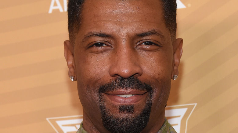 Deon Cole posing on red carpet